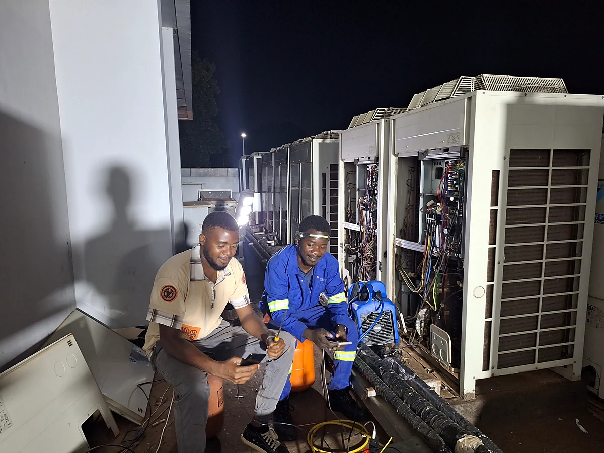 Topworks technicians carrying out Daikin VRV repairs and diagnostic work on commercial outdoor units