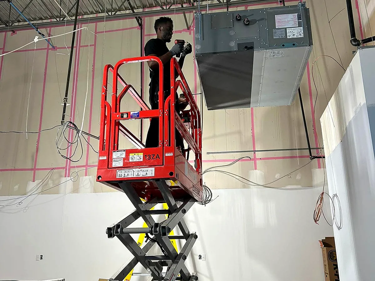 High-level HVAC installation using access equipment